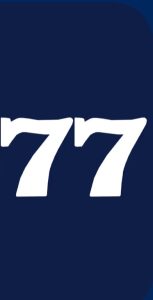 hm77 v Game logo with blue background and gold AT text showing online earning gaming app in Pakistan.